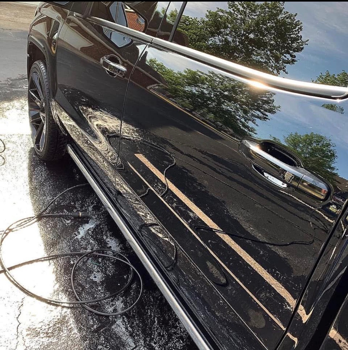 Mirror-shine black SUV after full detail
