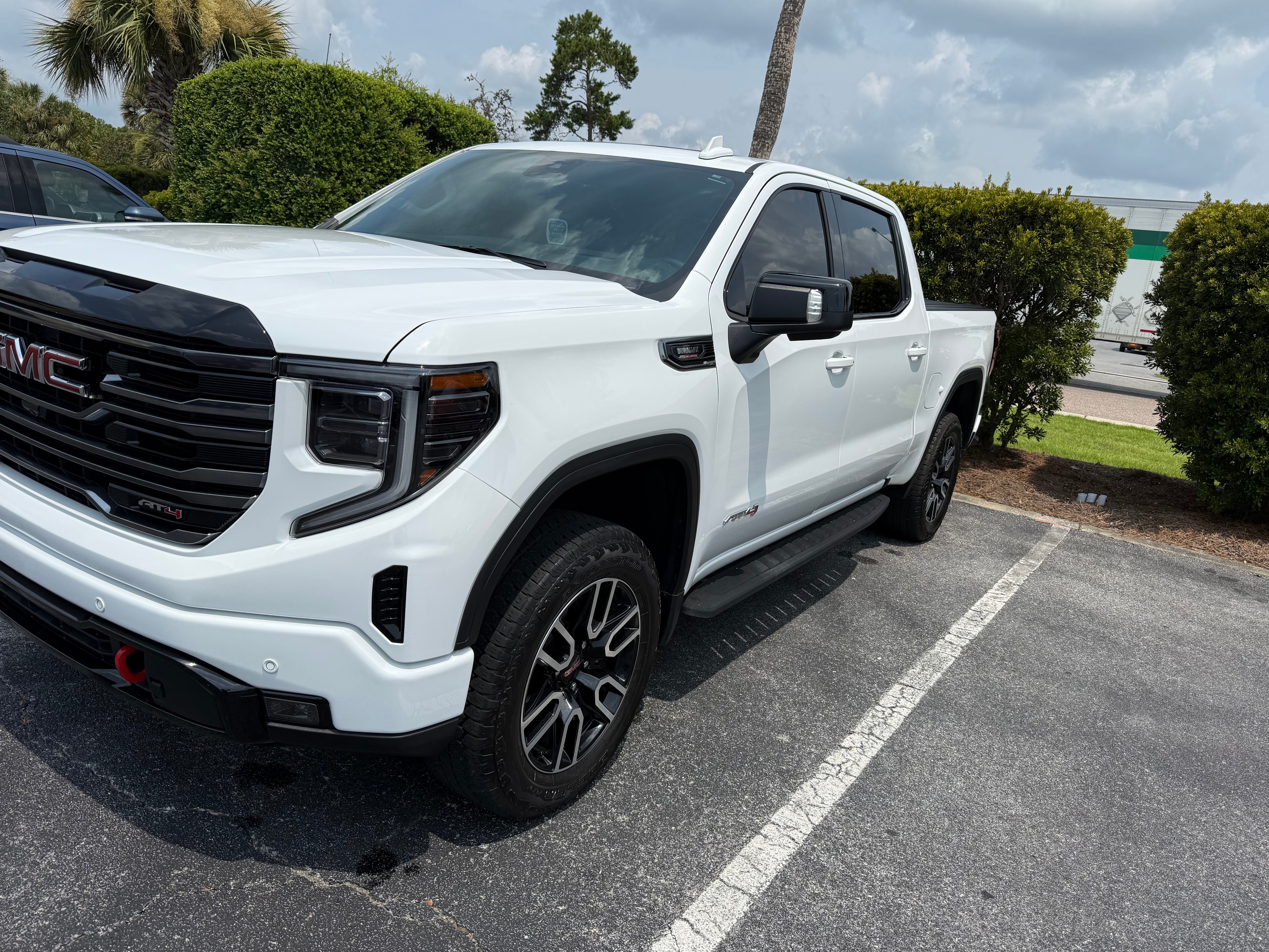 White GMC Sierra AT4 front view after full detail