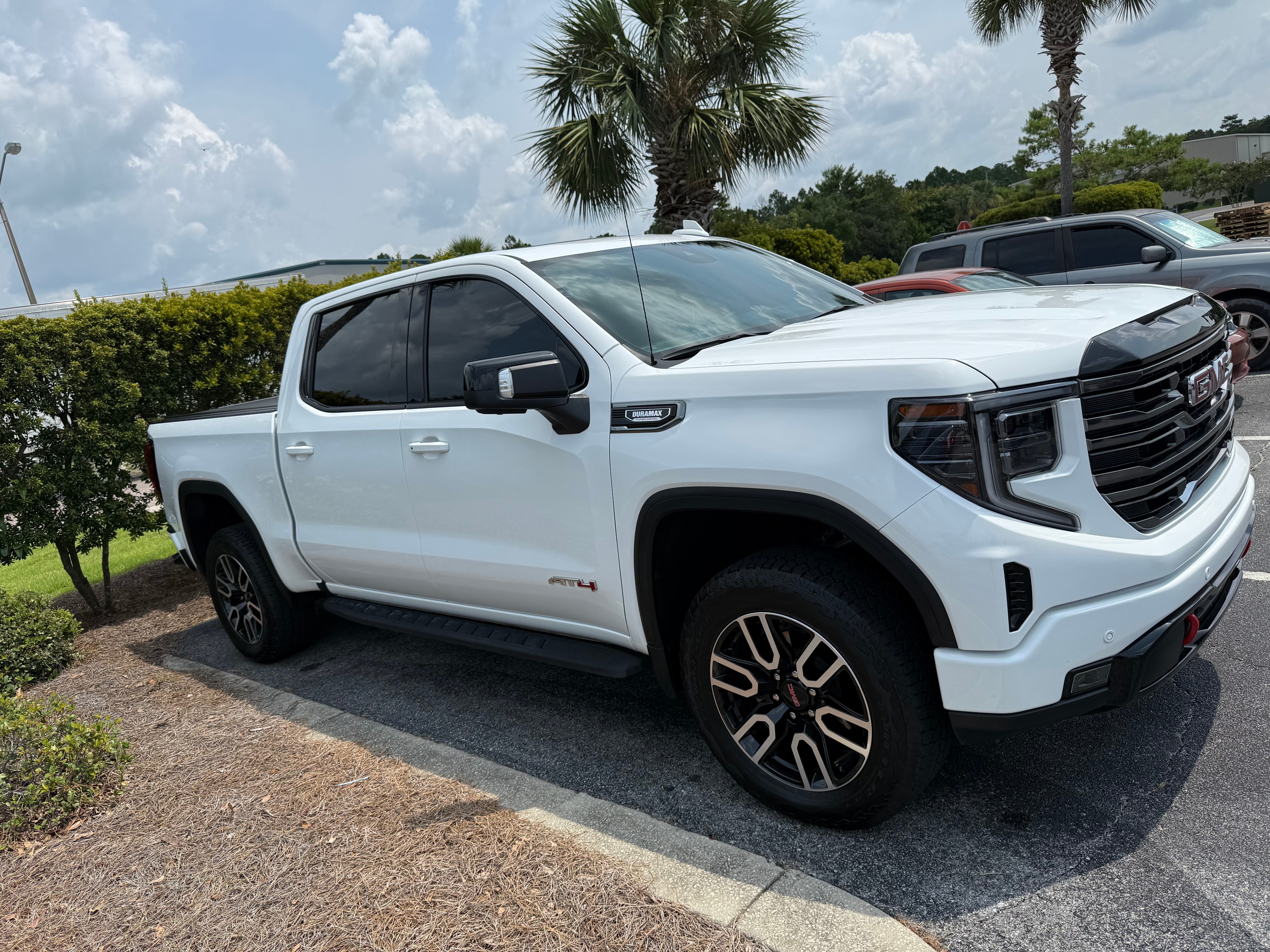 White GMC Sierra AT4 side profile after detail